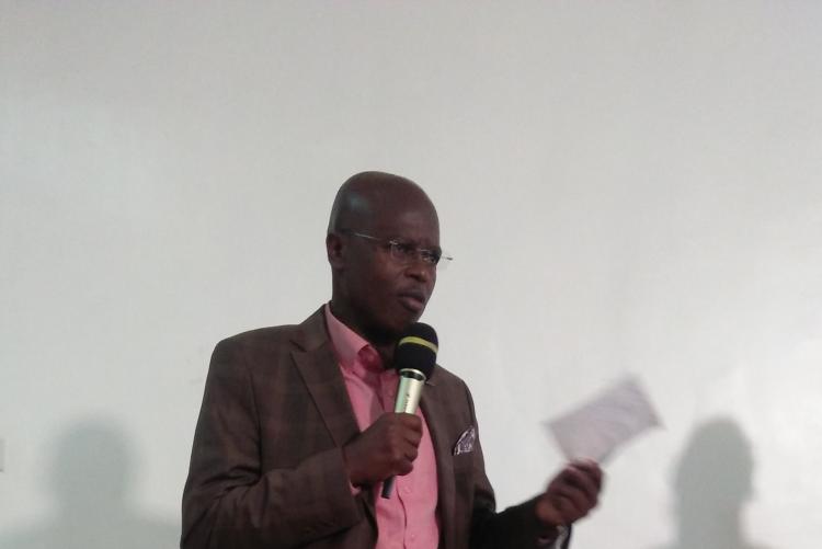 DR. OMBONGI MODERATING THE PRESENTATION